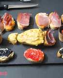 Tabla de aperitivos con caviar y cecina