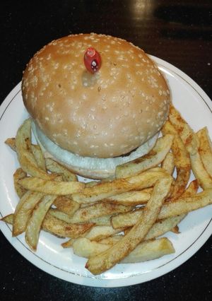 A picture of Chicken Burger (Homemade Patties) With Fries.