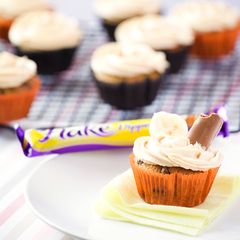 A picture of Banana Cupcakes with Peanut Butter Frosting.