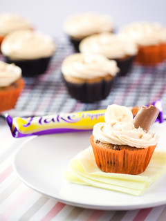A picture of Banana Cupcakes with Peanut Butter Frosting.