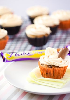 A picture of Banana Cupcakes with Peanut Butter Frosting.