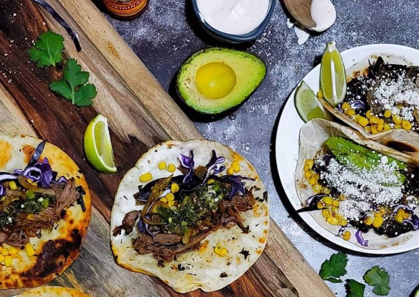 Slow-cooked lamb tacos with mint flavored ayole