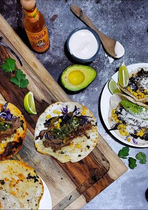 A picture of Slow Cooker Lamb Tacos with Mint Relish and Spicy Aioli.