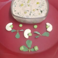 A picture of Methi Matar Malai in White Gravy.