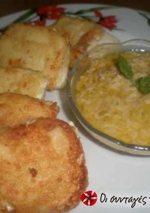 A picture of Feta cheese saganaki with ouzo sauce.
