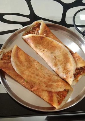A picture of Breakfast cheese and podi dosa.
