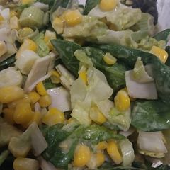 A picture of Healthy salad with spring onions, sweetcorn, avocado, baby spinach and little gem lettuce.