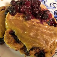 A picture of Spelt blueberry pancakes with tahini sauce - vegan.