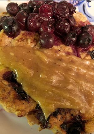 A picture of Spelt blueberry pancakes with tahini sauce - vegan.