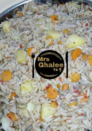 A picture of Carrots and potatoe rice.