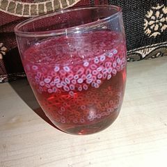 A picture of Rooh afza drink with chia seeds.