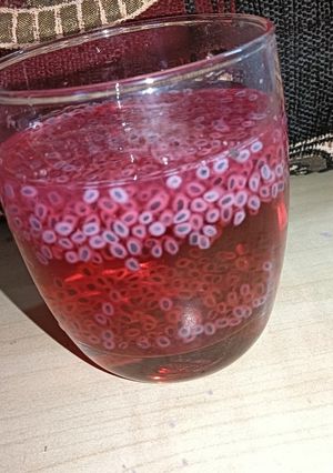 A picture of Rooh afza drink with chia seeds.