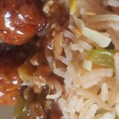 A picture of Fried rice and manchurian.