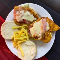 A picture of Delicious Chicken and bacon burgers made by hubby!.