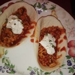 A picture of Chicken sloppy joe in taco bowl.