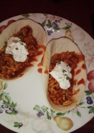 A picture of Chicken sloppy joe in taco bowl.