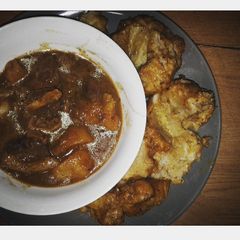 A picture of Beef curry and dumplings.