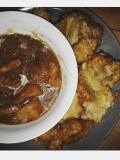 A picture of Beef curry and dumplings.