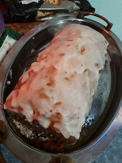 Una foto de Budín de frutos secos glaseado