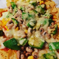 A picture of Nachos with Avocados.