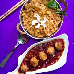 A picture of Schezwan upma with veg bonda Manchurian.