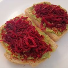 A picture of Avocado and beetroot toast.