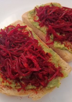 A picture of Avocado and beetroot toast.