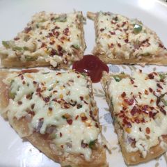 Veg Cheese Paneer Pan Pizza A picture of Veg Cheese Paneer Pan Pizza.