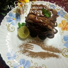 A picture of Midnight lemon chocolate crepes -"A zesty, indulgent dessert".
