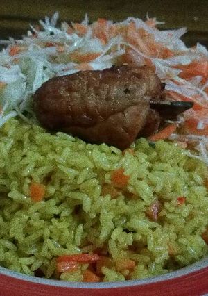 A picture of Fried Rice and Chicken with coleslaw.