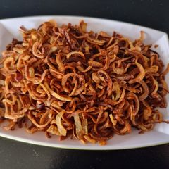 A picture of Barista (fried onions) and veg Biriyani.