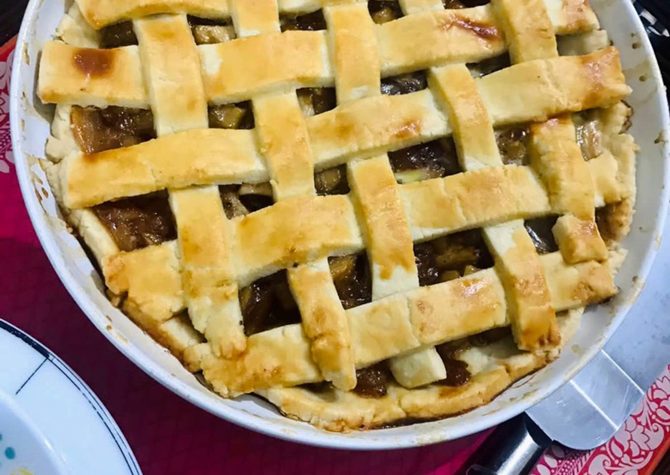 Apple pie with flaky butter crust served with vanilla ice cream