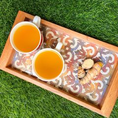A picture of Fresh Turmeric and Ginger Brew.
