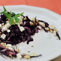 A picture of Red cabbage salad with almonds, feta and dried cherries.