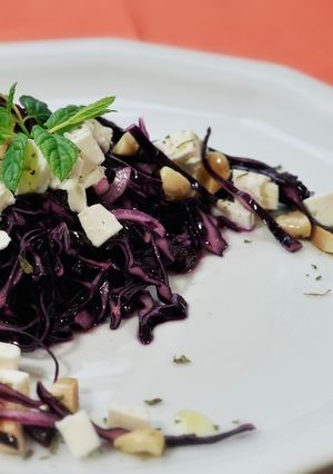 A picture of Red cabbage salad with almonds, feta and dried cherries.