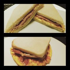 A picture of Smoked cheese omelette and bacon sandwich.