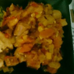 A picture of Pork sauages in tomato onion chilli sauce.