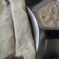 A picture of Masala dosa with peanutchutney.
