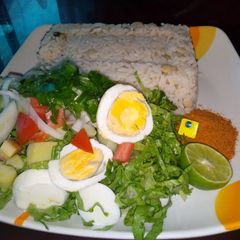 Rice and beans with salad A picture of Rice and beans with salad.