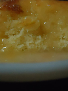 A picture of Lemon cake with honey and lemon sauce.