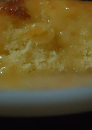 A picture of Lemon cake with honey and lemon sauce.