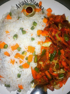 A picture of Veggies rice and veggies sauce.