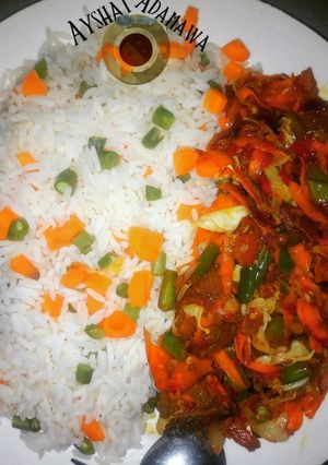 A picture of Veggies rice and veggies sauce.