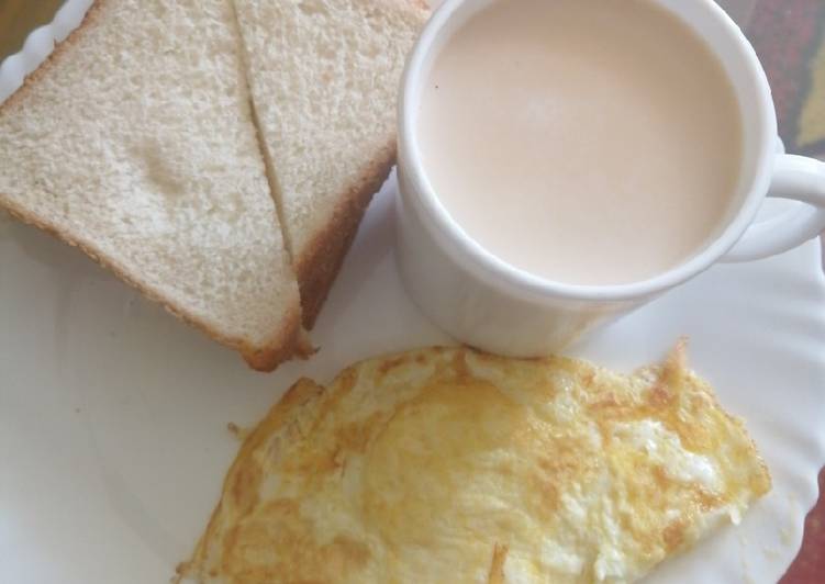 Cinnamon tea milk, slice of bread and eggs
