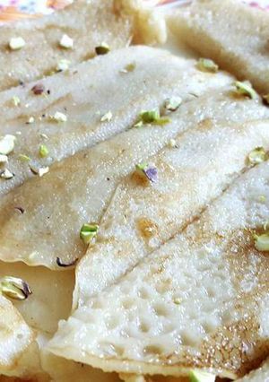 A picture of Patisapta pitha(stuffed pancake roll).