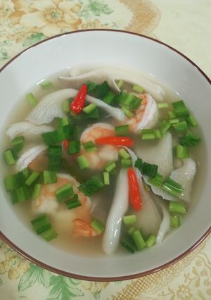 A picture of Clear Tom Yum Soup with Shrimp and Oyster Mushrooms.