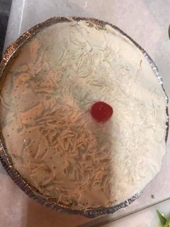 Una foto de Pay de coco y queso crema