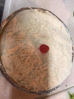 Una foto de Pay de coco y queso crema