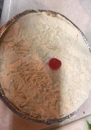 Una foto de Pay de coco y queso crema
