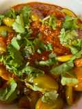 Tal varu tomato nu shakRaw baby tomato and sesame curry